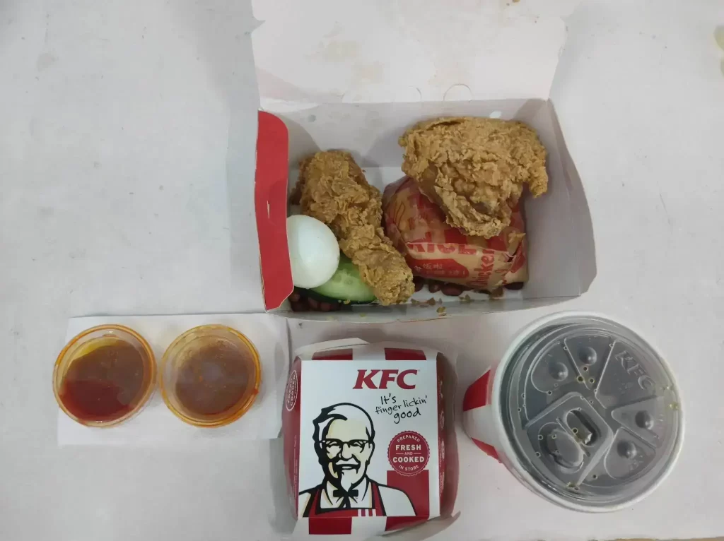 KFC Value combo offer fried chicken, wrap, drinks and sauces and box meal kfc logo on box