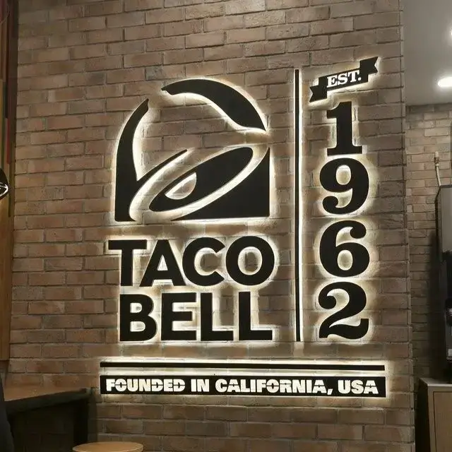 taco Bell Malaysia Outlet Qall with text on wall
