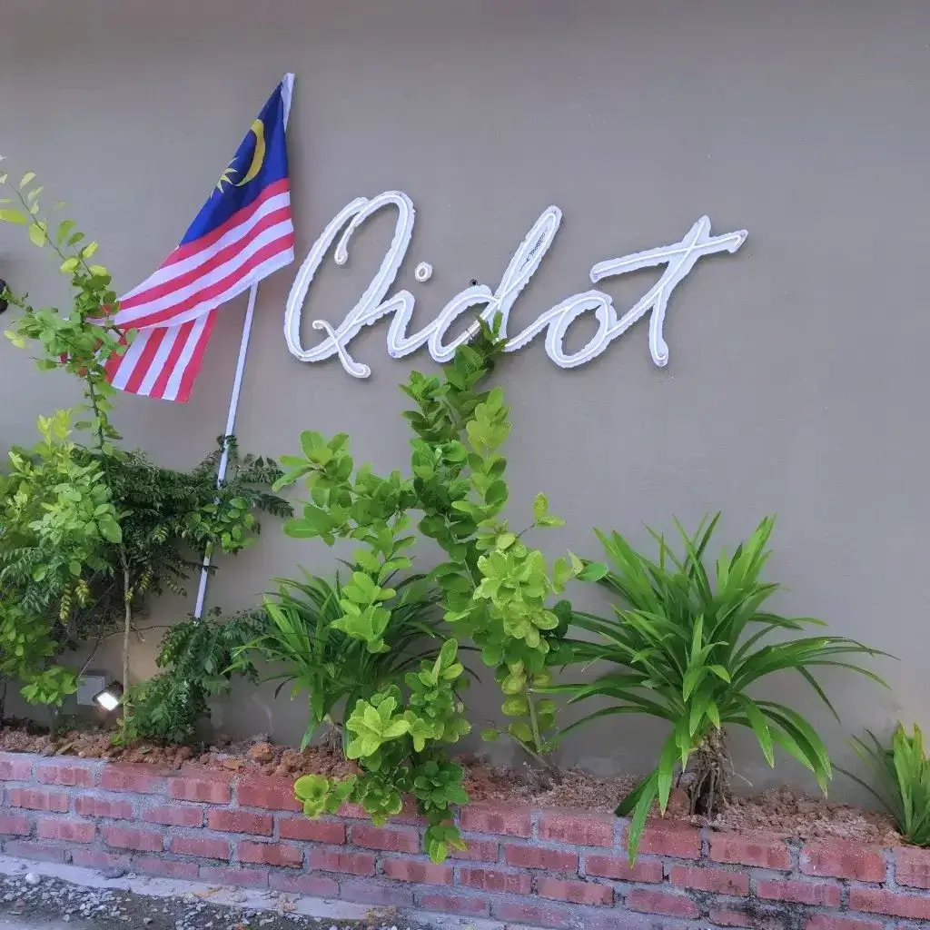 Qidot Logo On wall With Malaysia Flag