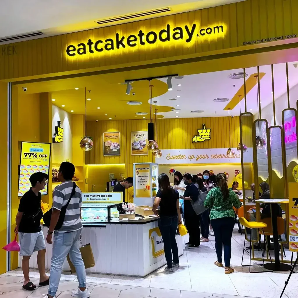 Eat Cake today In outlet Image while Standing in Front Of Outlet